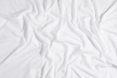 Crumpled white fabric as background, top view