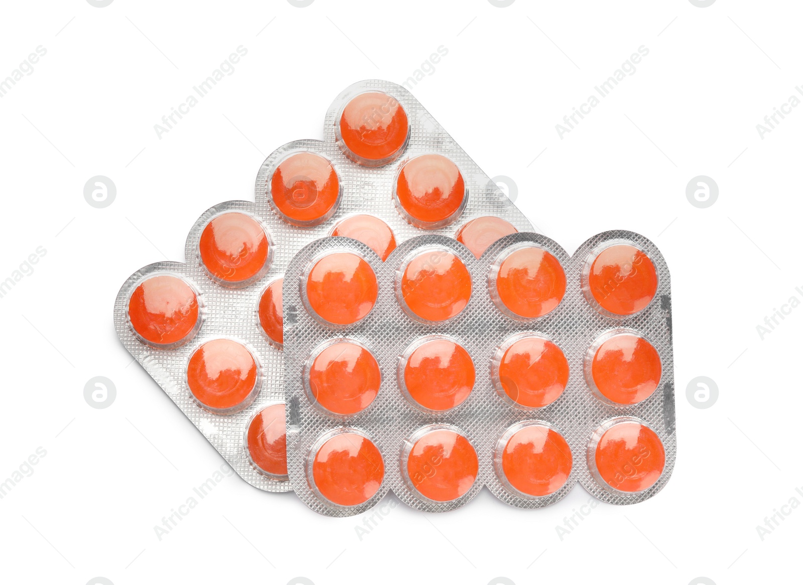 Photo of Blisters with orange cough drops on white background, top view