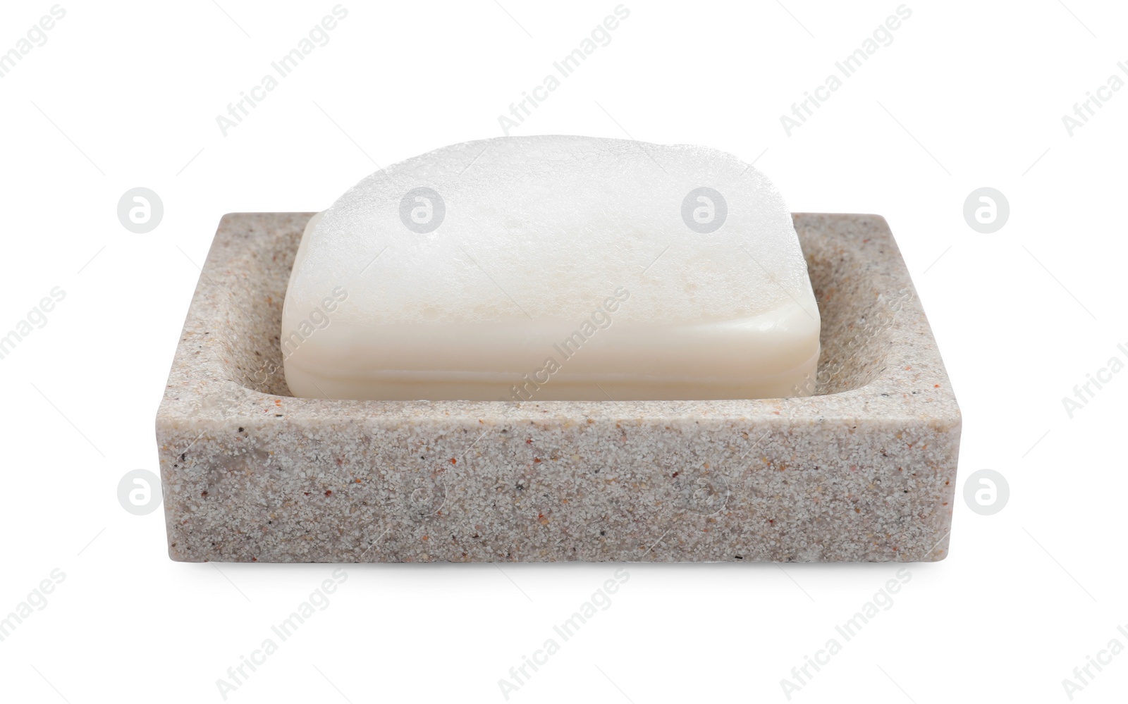 Photo of Soap bar with fluffy foam in holder on white background