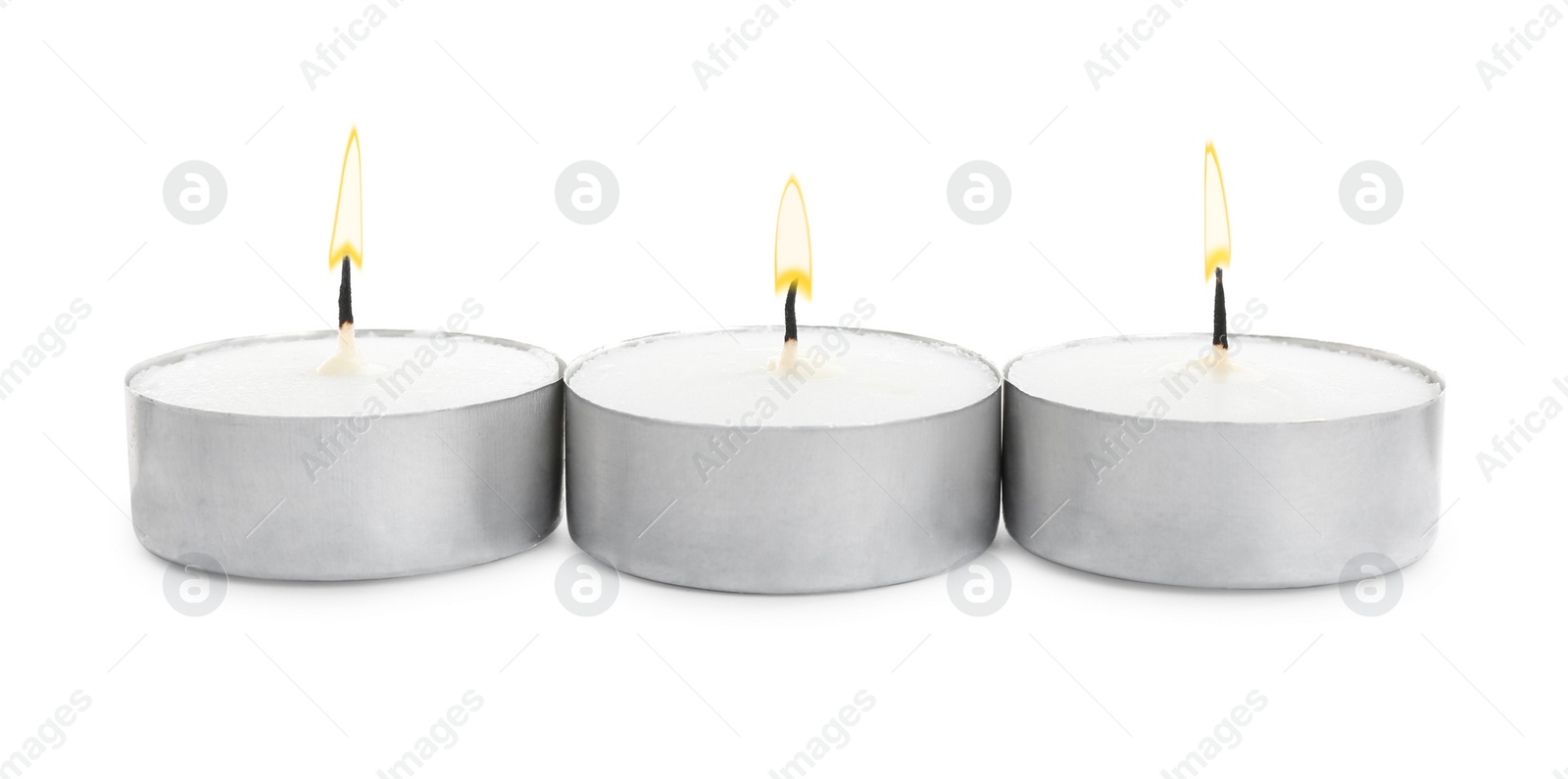 Photo of Wax candles on white background. Interior elements