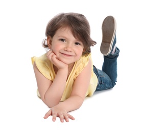 Photo of Happy little girl in casual outfit lying on white background