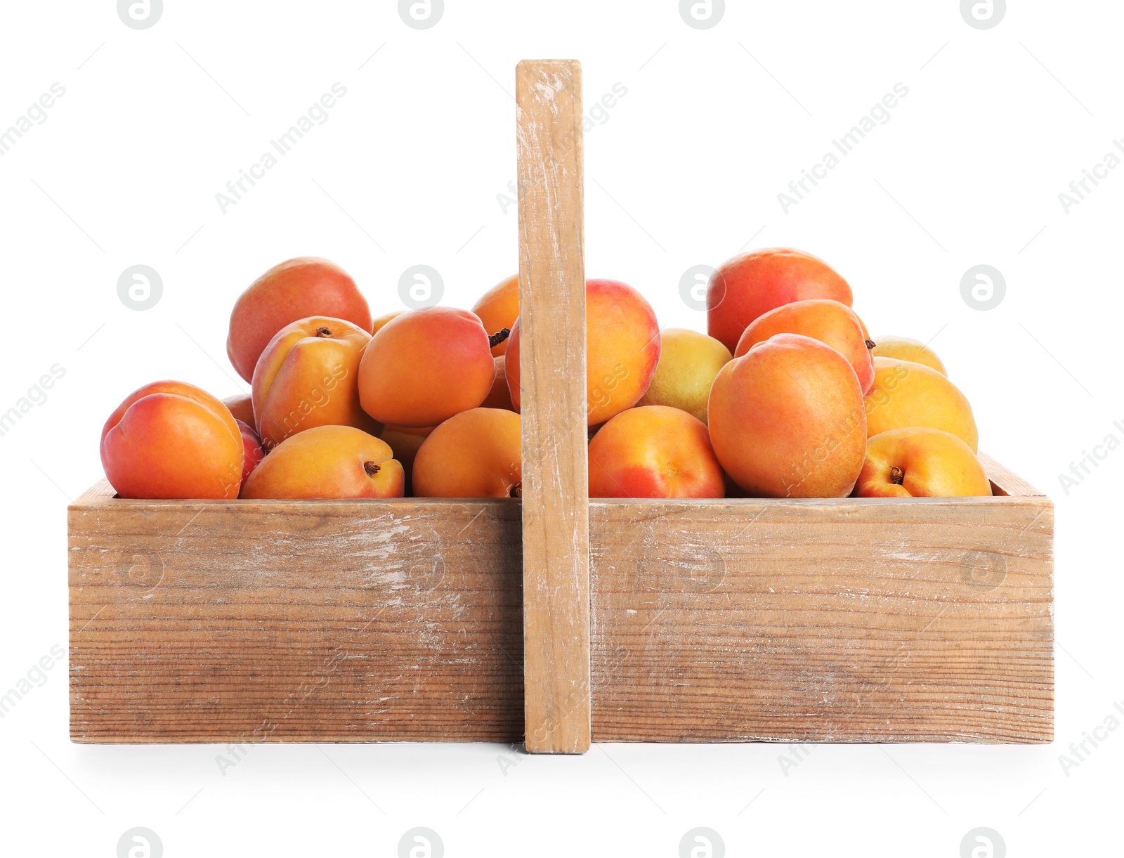 Photo of Delicious ripe apricots in wooden crate isolated on white