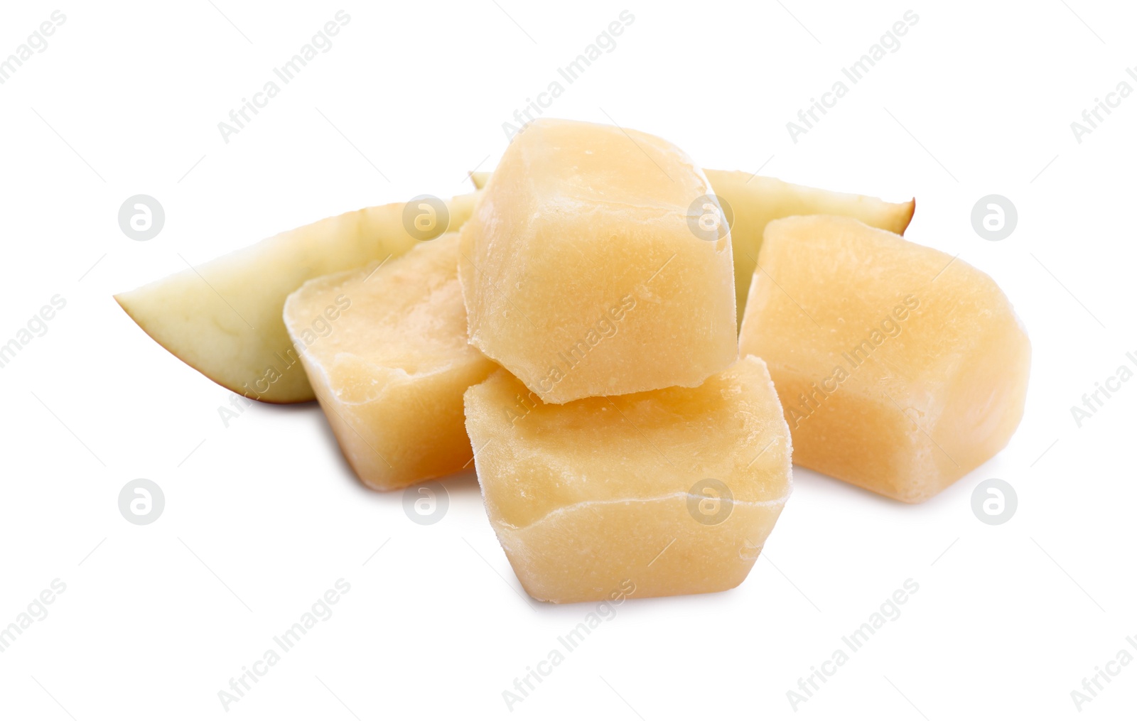 Photo of Frozen apple puree cubes and fruit on white background