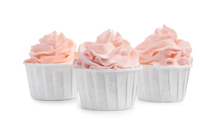 Photo of Tasty cupcakes with cream isolated on white