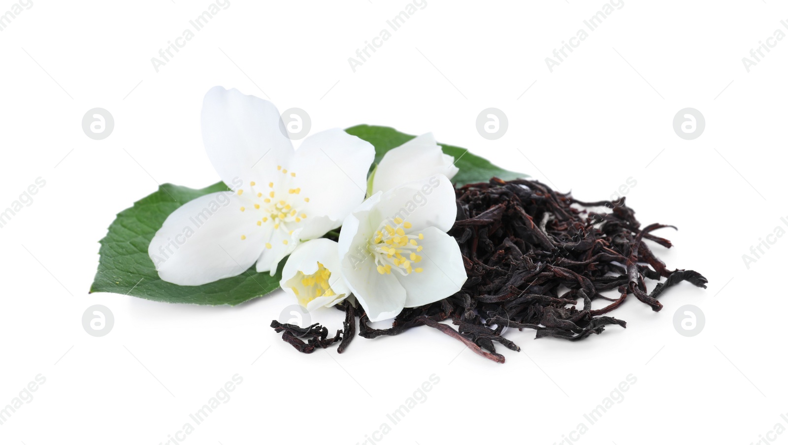 Photo of Dry green tea and fresh jasmine flowers isolated on white