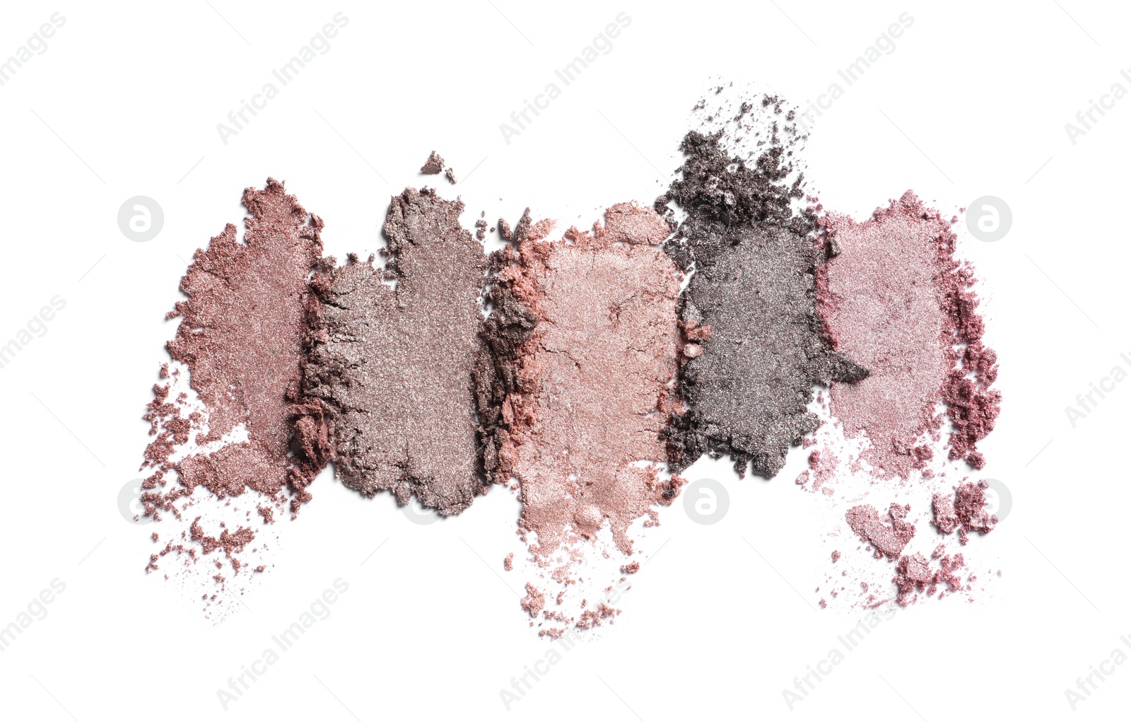 Photo of Crushed eye shadows on white background. Professional makeup product