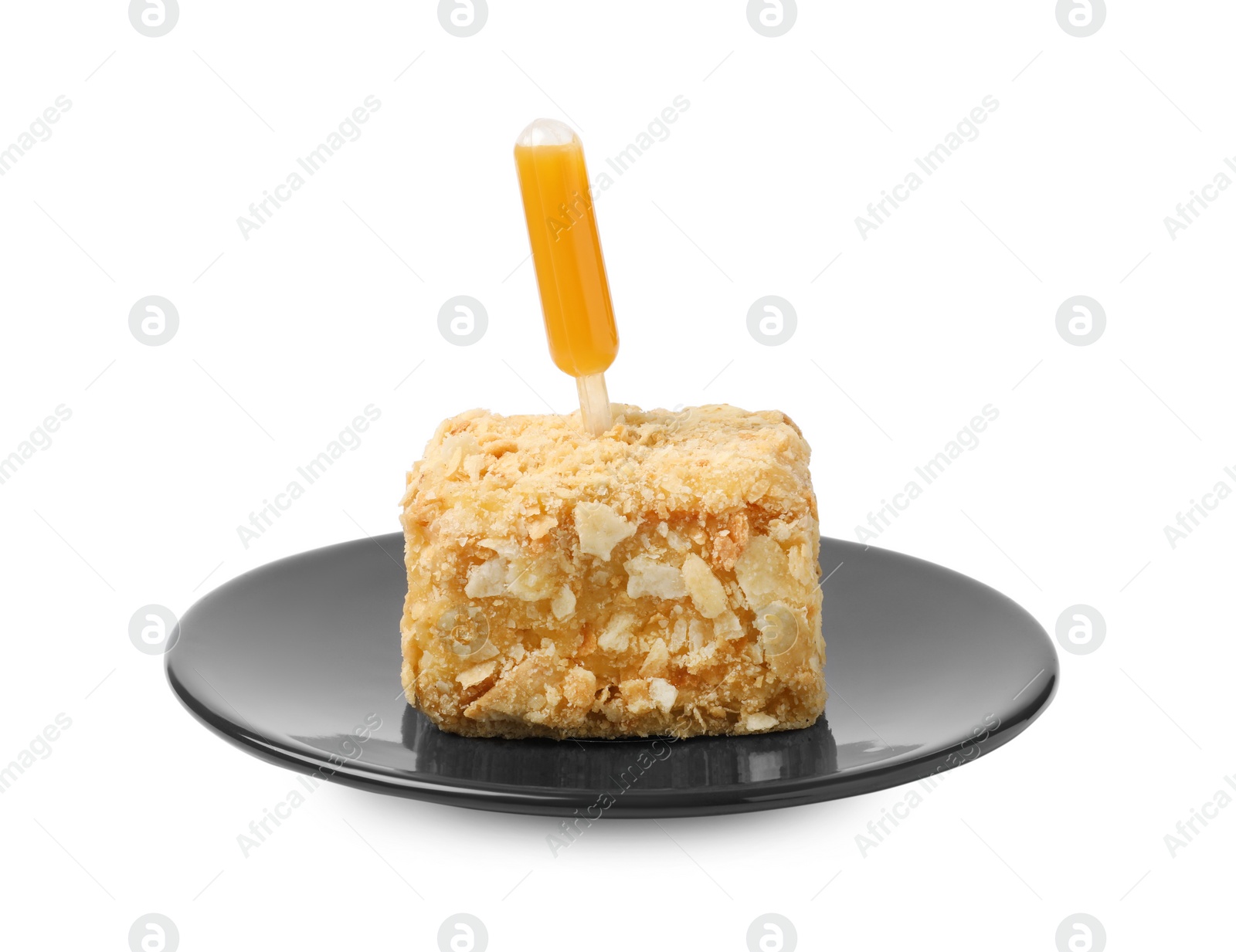 Photo of Piece of Napoleon cake with jam pipette on white background