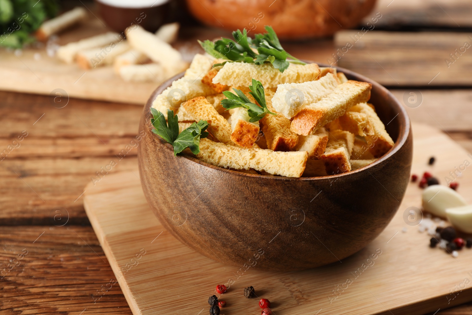 Photo of Delicious hard chucks in bowl on wooden table