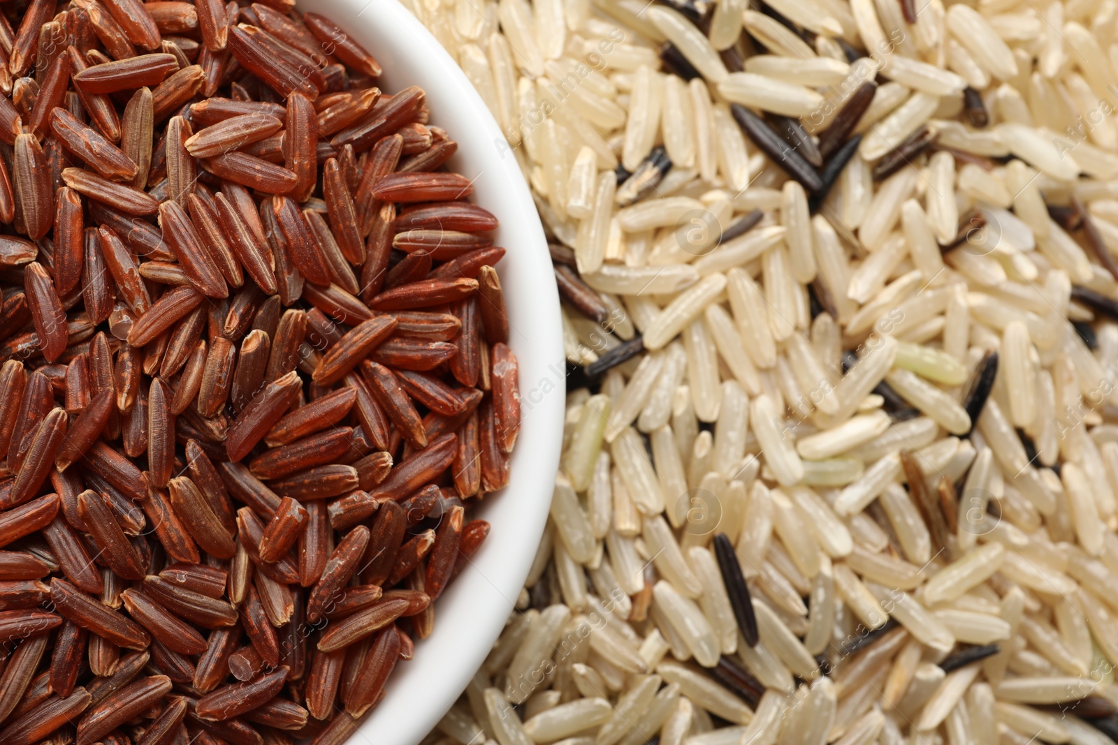 Photo of Different sorts of rice as background, closeup