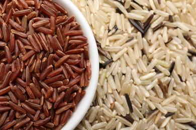 Photo of Different sorts of rice as background, closeup