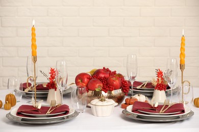 Elegant festive setting with autumn decor on table