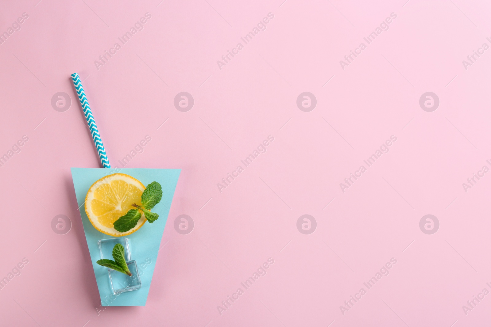 Photo of Creative lemonade layout with lemon slice, mint and ice cubes on pink background, top view. Space for text