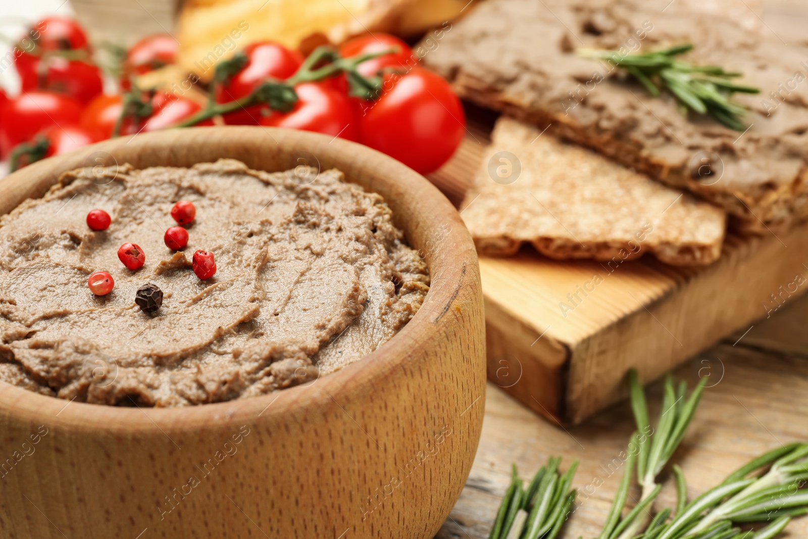 Photo of Tasty liver pate with pepper on table, closeup