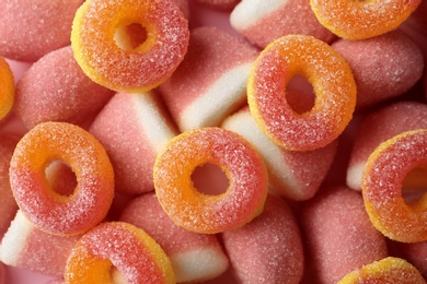 Photo of Sweet color jelly candies as background, top view