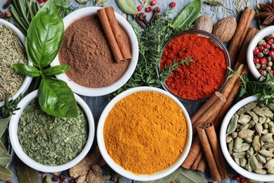 Photo of Different natural spices and herbs on table, flat lay
