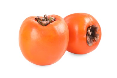 Photo of Delicious ripe juicy persimmons isolated on white