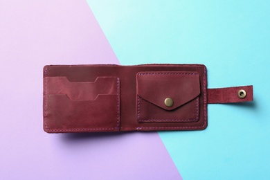 Photo of Stylish wallet on color background, top view