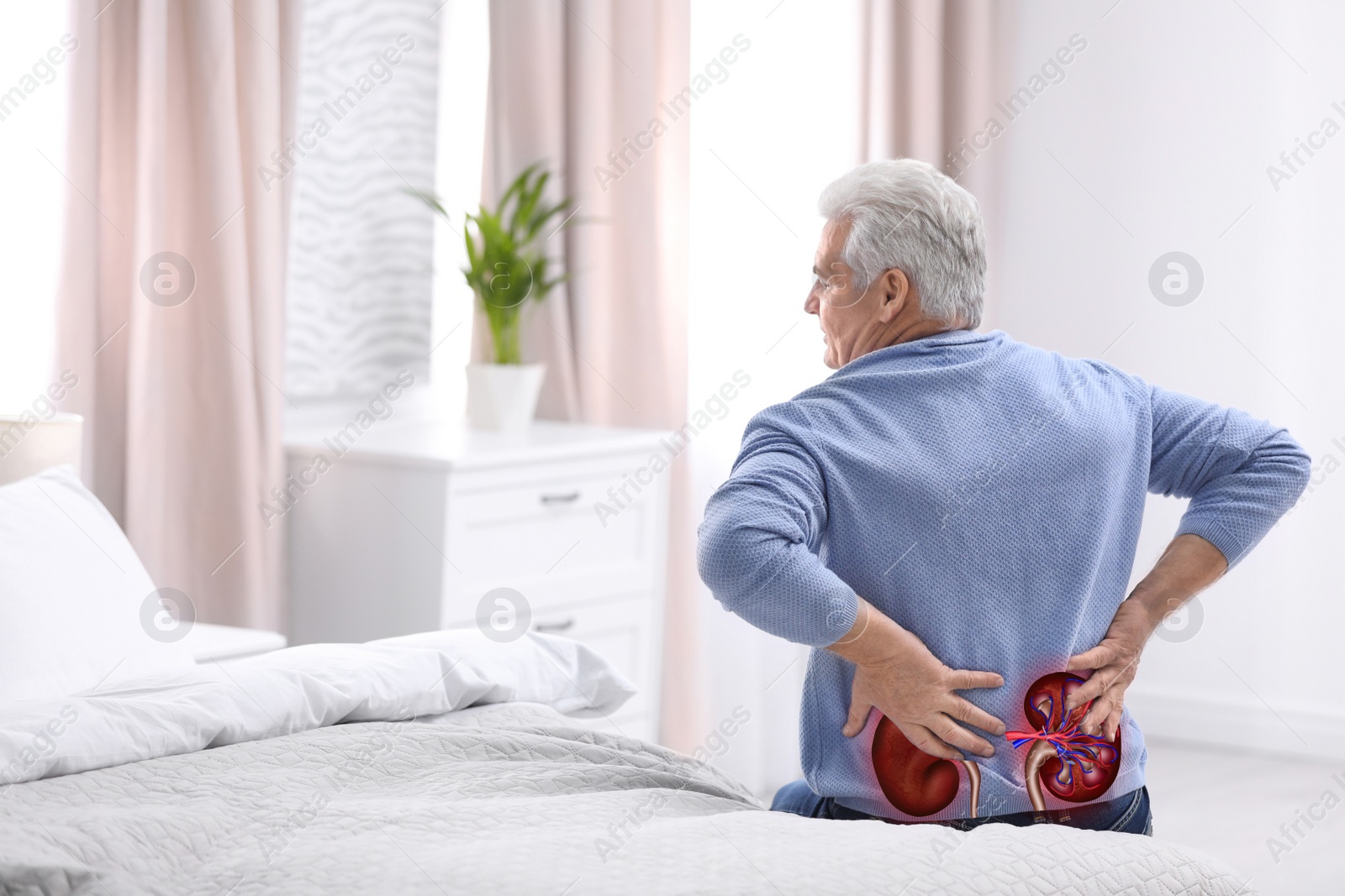 Image of Senior man suffering from kidney pain at home