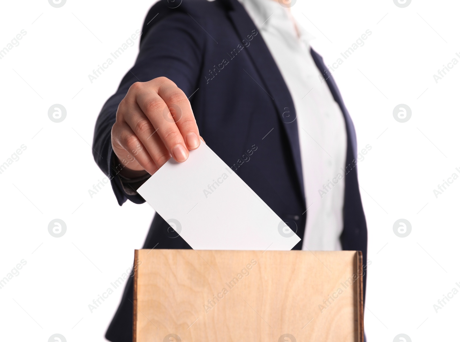 Photo of Woman putting her vote into ballot box on white background, closeup