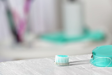 Photo of Manual toothbrush on table against blurred background