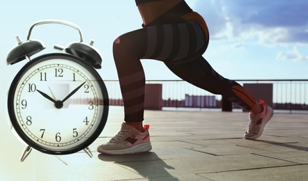 Image of Workout time. Double exposure of woman doing exercise on sunny morning outdoors and alarm clock