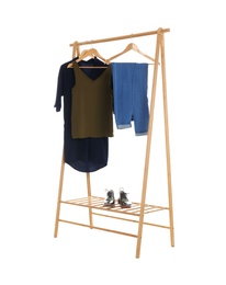 Photo of New wardrobe rack with stylish lady's clothes and shoes on white background