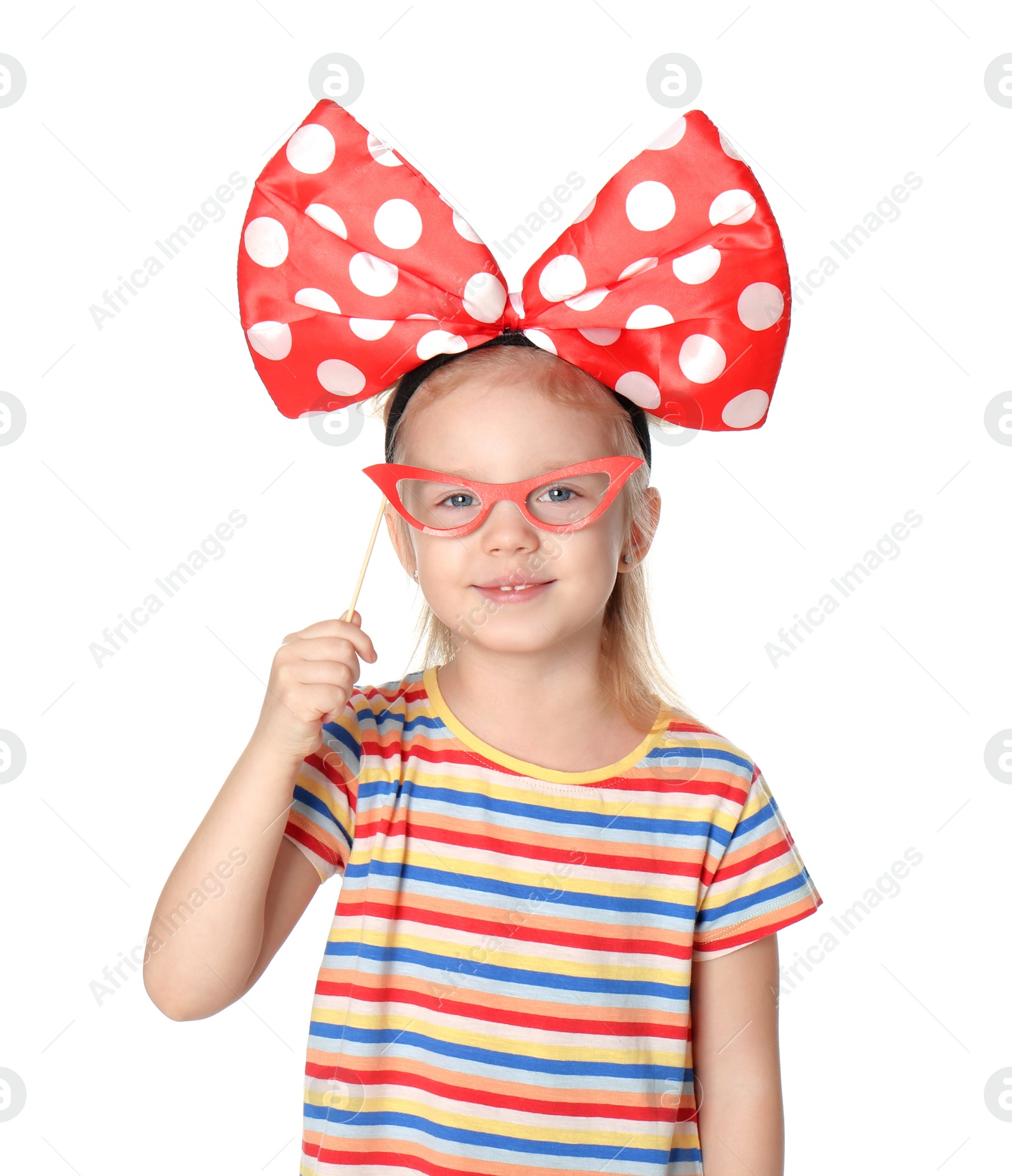 Photo of Little girl with large bow and funny glasses on white background. April fool's day