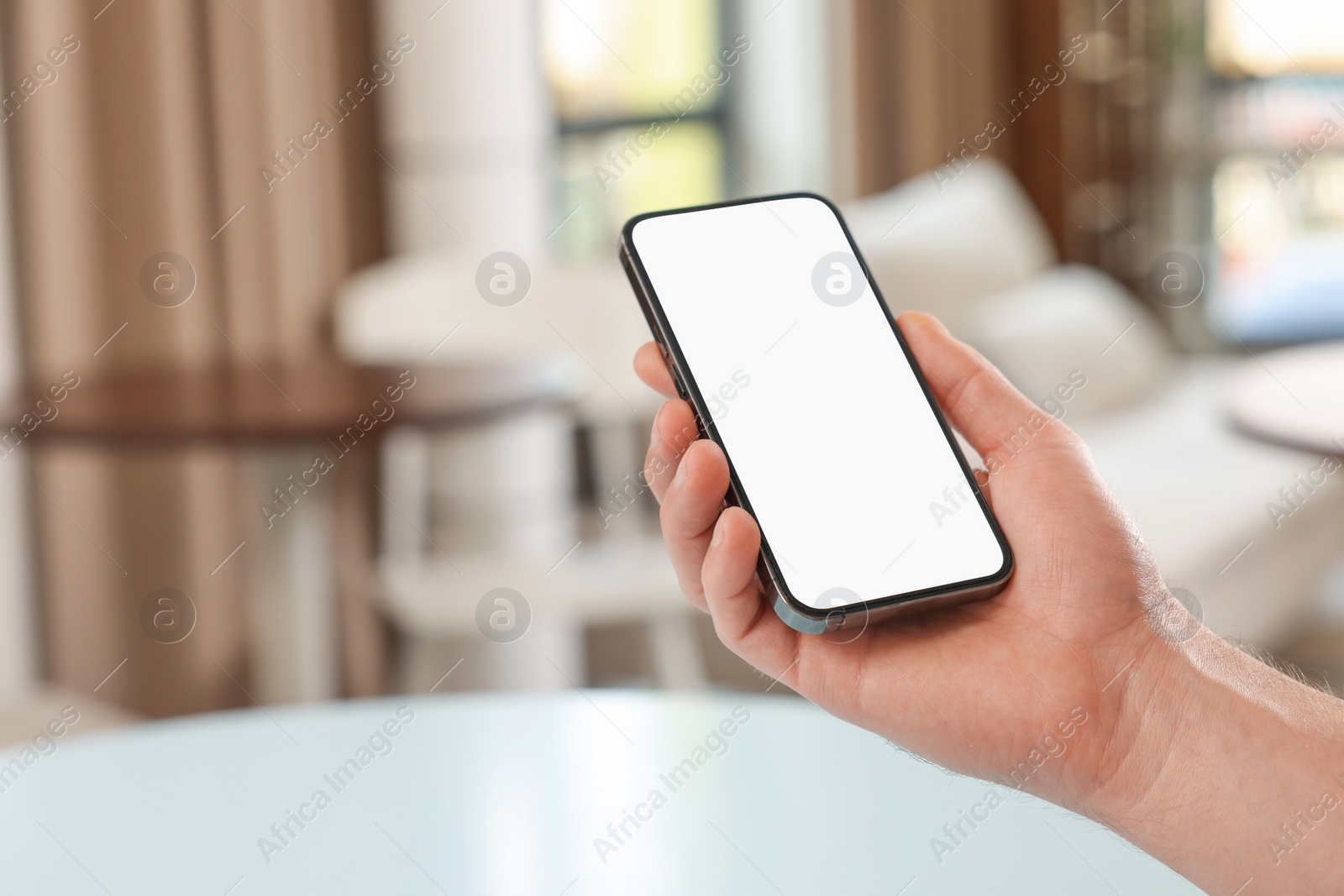 Photo of Man using smartphone in cafe, closeup. Space for text