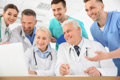 Photo of Group of doctors attending meeting in clinic. Cardiology conference