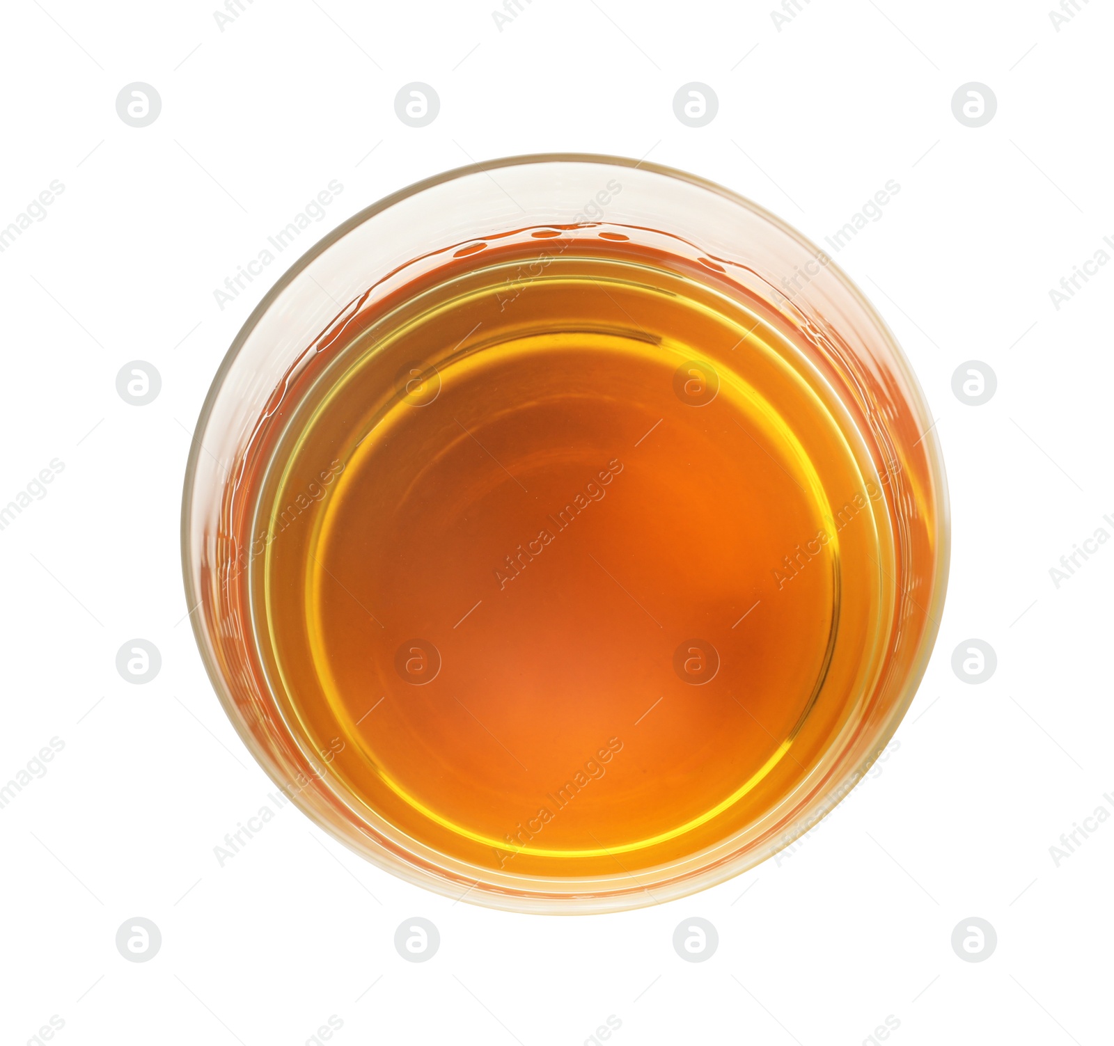 Photo of Glass of expensive whiskey on white background, top view