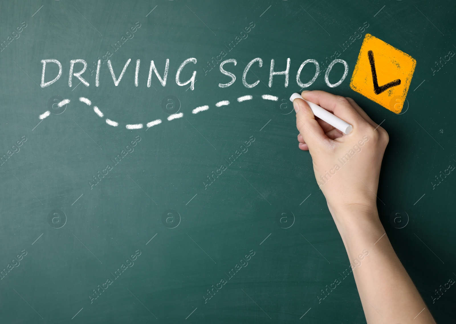 Image of  Driving school concept. Woman with white chalk near green board, closeup