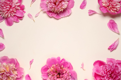 Photo of Beautiful pink peonies on beige background, flat lay. Space for text