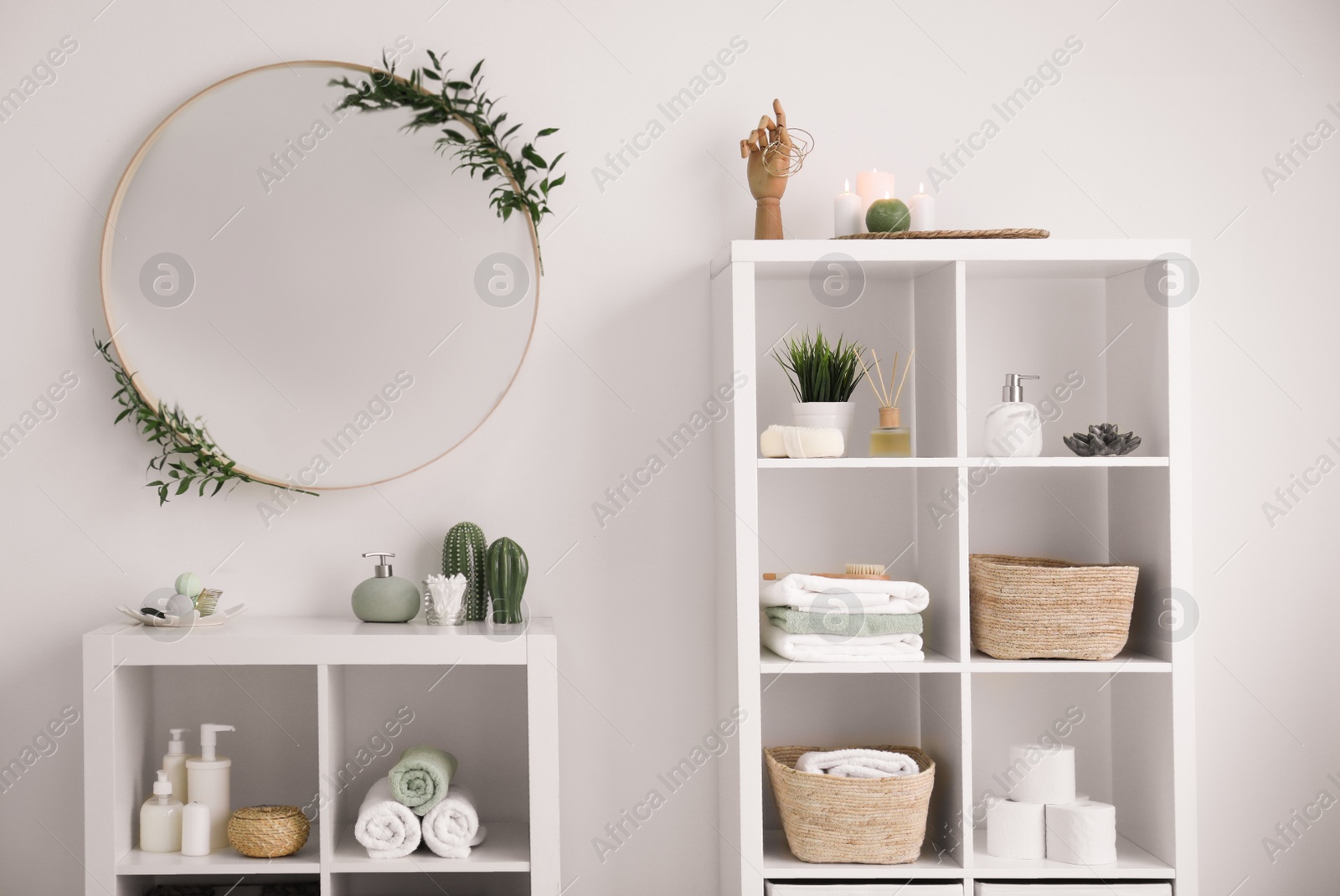 Photo of Elegant modern bathroom with mirror on white wall