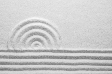 White sand with pattern as background, top view. Zen, meditation, harmony