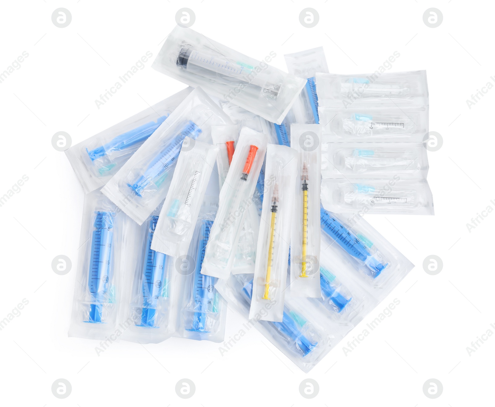 Photo of Different packed disposable syringes with needles on white background, top view