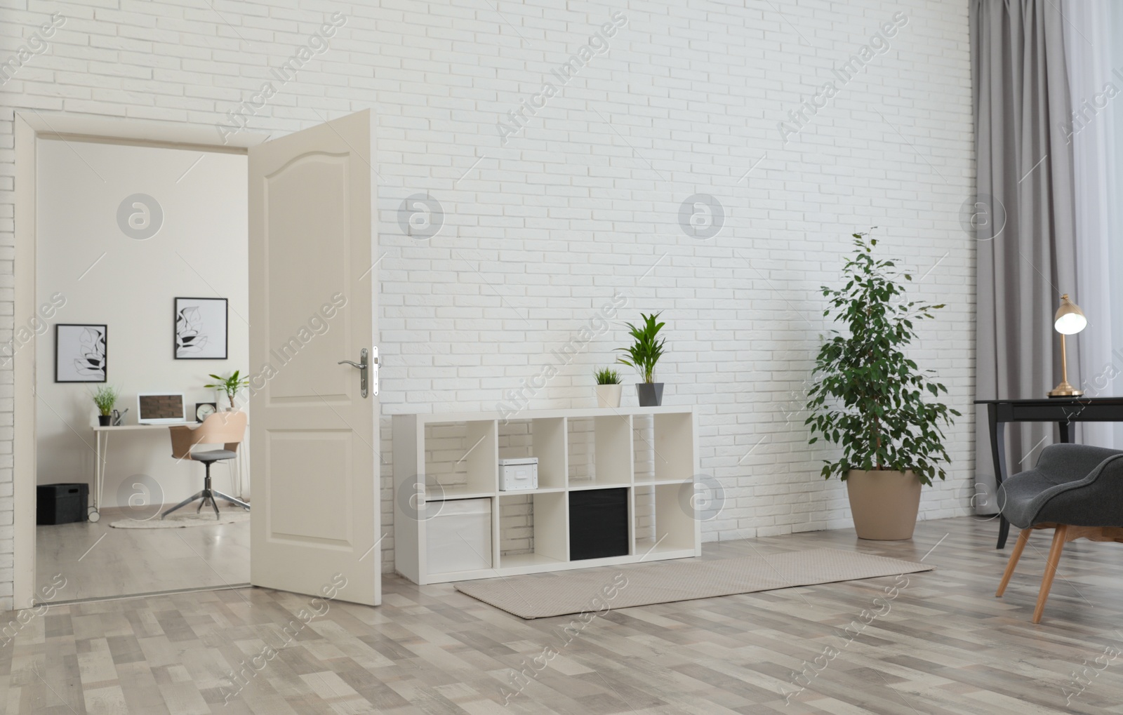 Photo of Living room interior with stylish furniture and open door