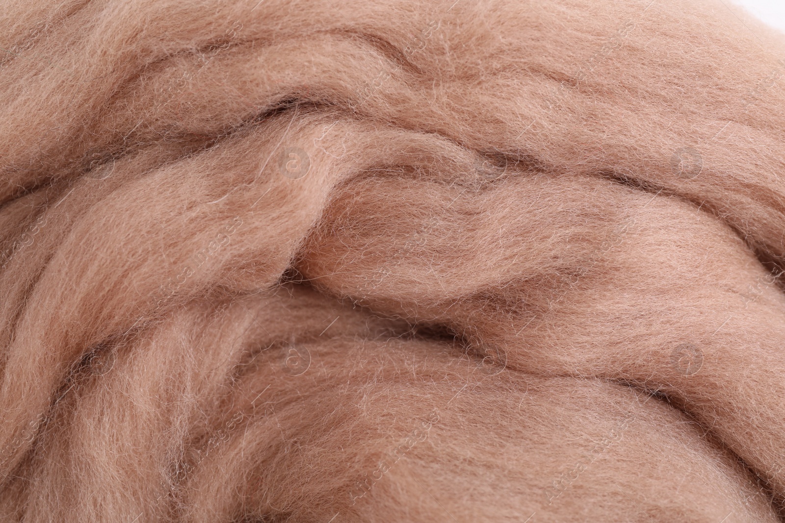 Photo of Soft felting wool as background, closeup view