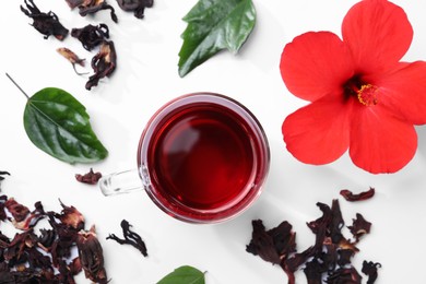 Flat lay composition with delicious hibiscus tea on white background