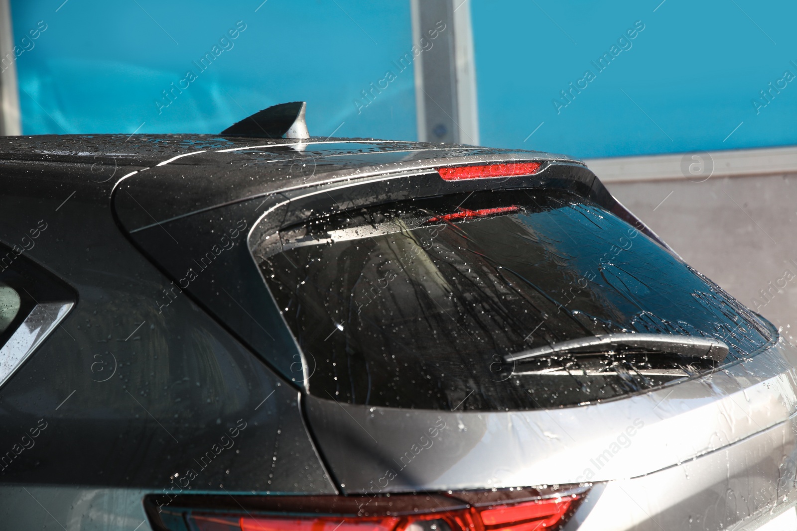 Photo of Clean wet automobile at professional car wash