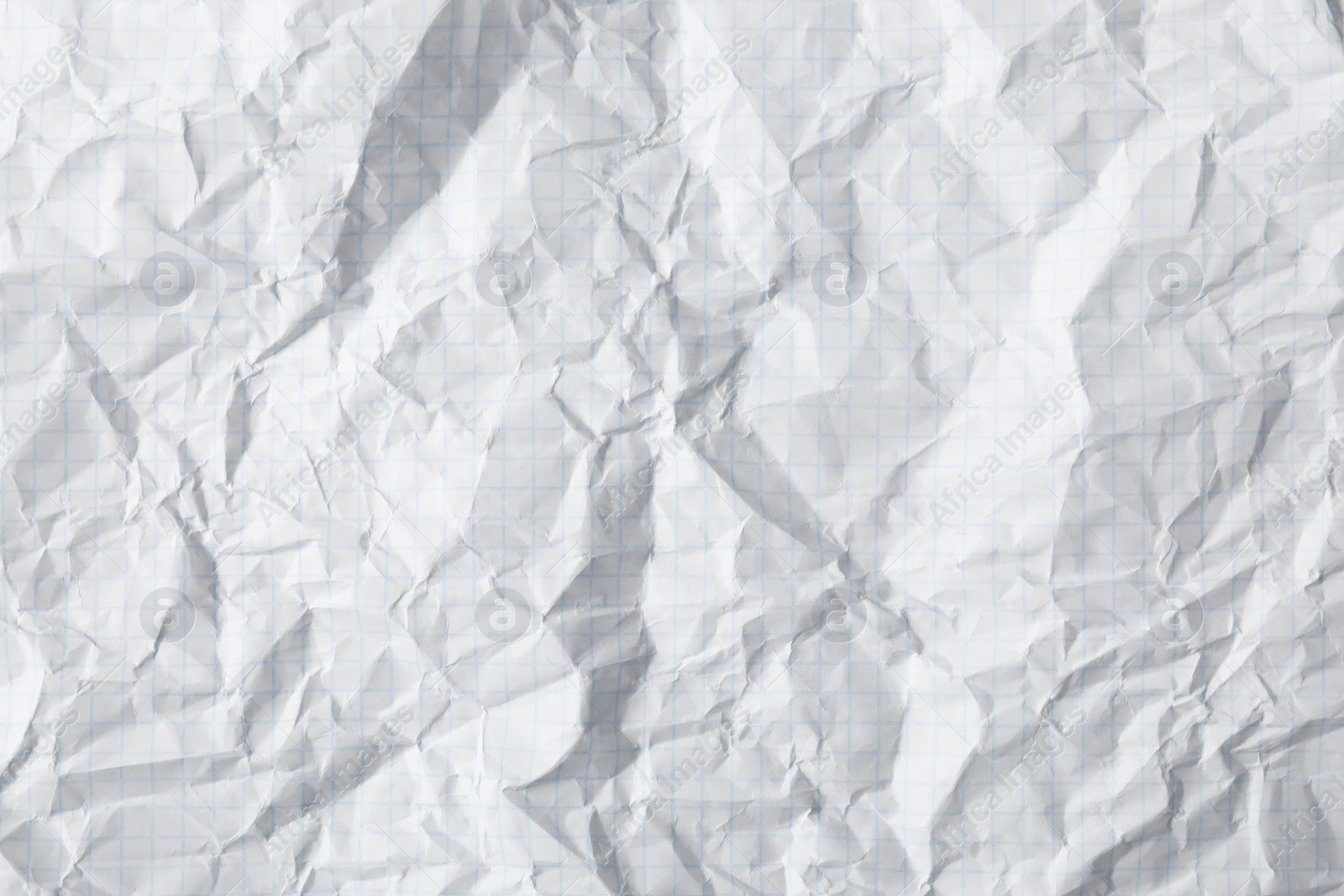 Photo of Crumpled sheet of paper as background, closeup