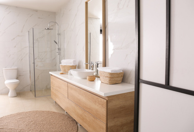 Photo of Large mirror and vessel sink in bathroom