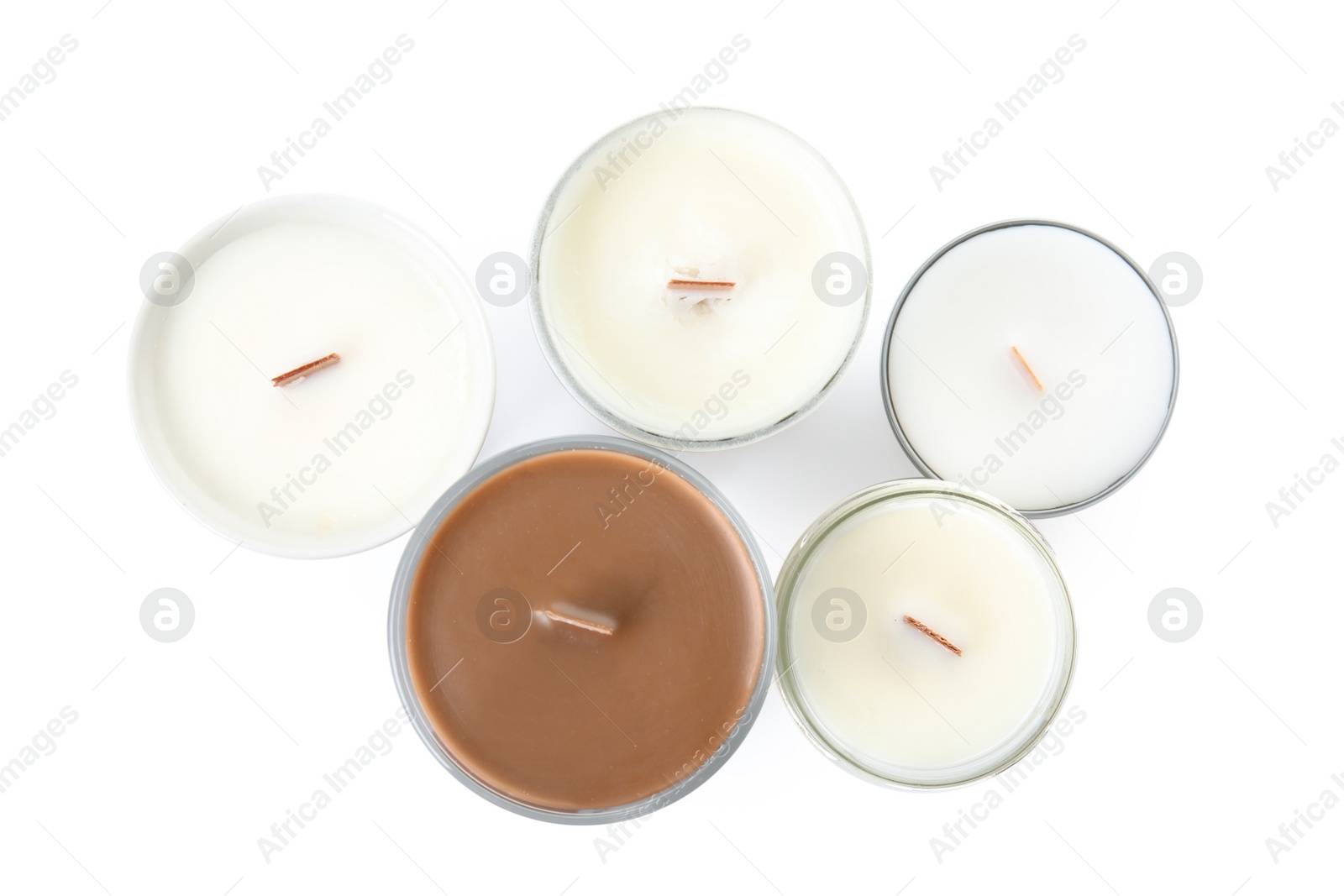 Photo of Beautiful candles with wooden wicks on white background, top view