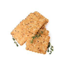 Photo of Cereal crackers with flax, sesame seeds and thyme isolated on white, above view