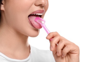 Photo of Woman brushing her tongue with cleaner on white background, closeup