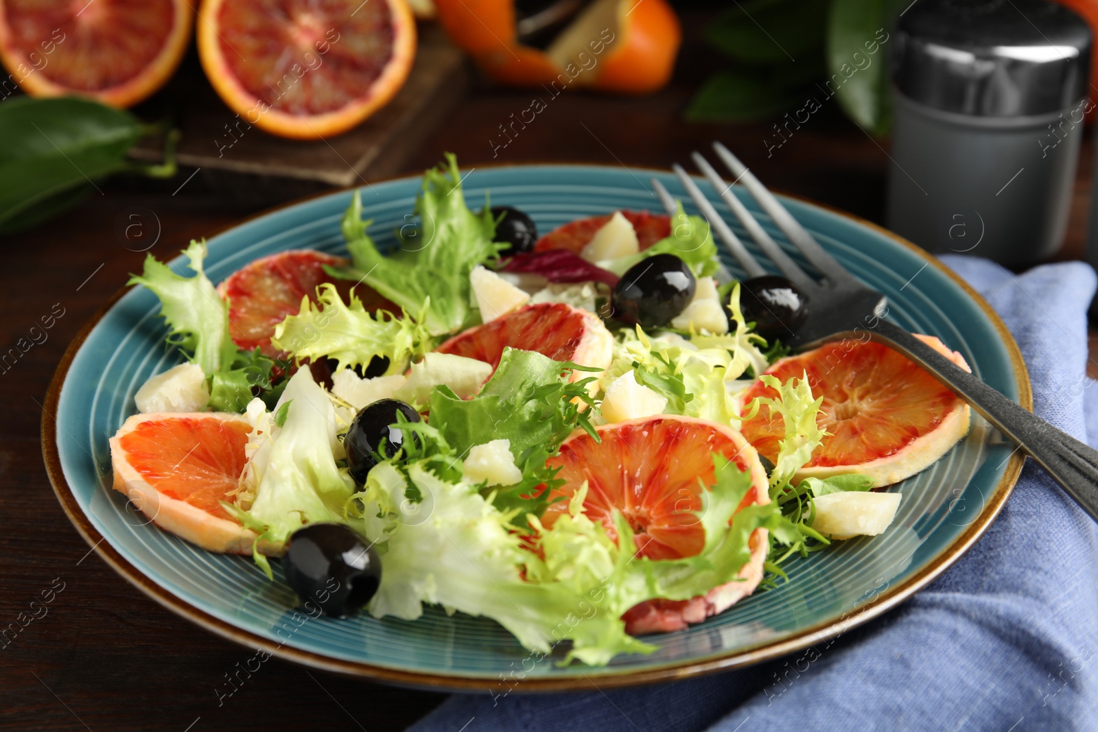 Photo of Plate of delicious sicilian orange salad on table, closeup