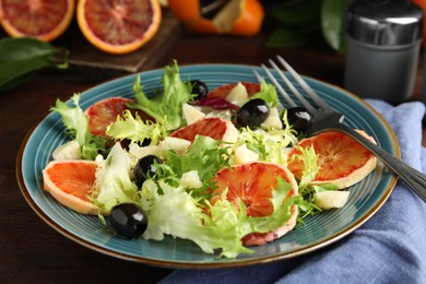 Photo of Plate of delicious sicilian orange salad on table, closeup
