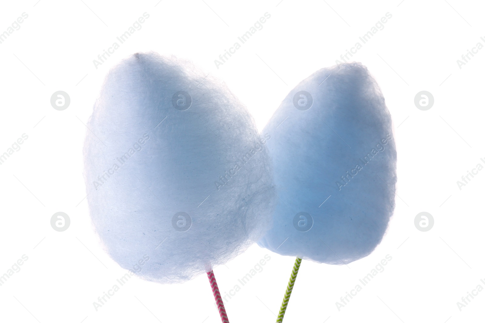 Photo of Sticks with yummy cotton candy isolated on white