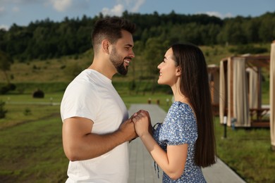 Photo of Romantic date. Beautiful couple spending time together outdoors