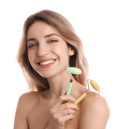 Young woman with natural face rollers on white background