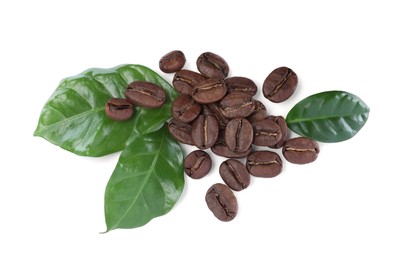 Photo of Roasted coffee beans with fresh leaves on white background, top view
